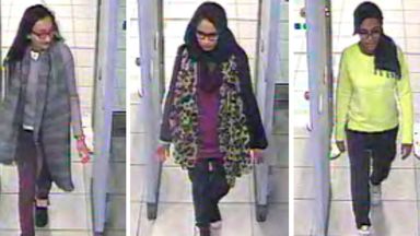 FILE - This is a Monday Feb. 23, 2015 file handout image of a three image combo of stills taken from CCTV issued by the Metropolitan Police Kadiza Sultana, left, Shamima Begum, centre and and Amira Abase going through security at Gatwick airport, before they caught their flight to Turkey. The Dutch man who married a British teenager after she ran away to join the Islamic State group says he wants to return home to the Netherlands with Shamima Begum and their newborn son. Yago Riedijk tells the B